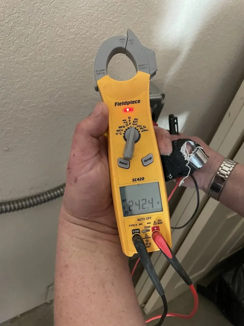 Voltage testing with clamp meter during Circuit Breaker Repair in Yellow Springs